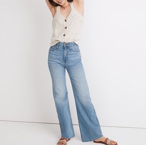 Madewell 11" High-Rise Flare Jeans in Conwell Wash Distressed at the bottom.